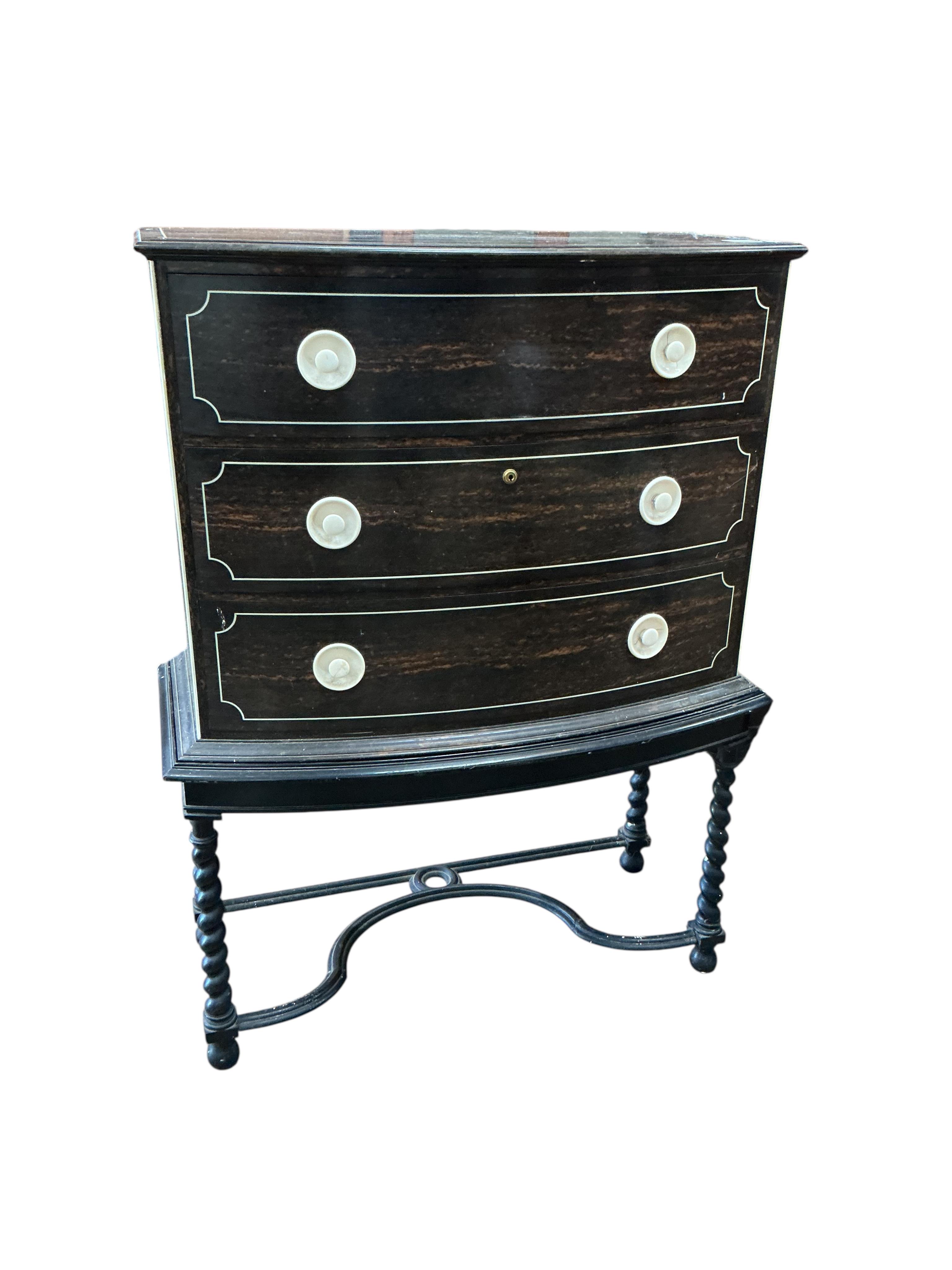 An early 20th century ivory mounted coromandel three drawer bowfront chest, stamped Callow of Mount Street, London